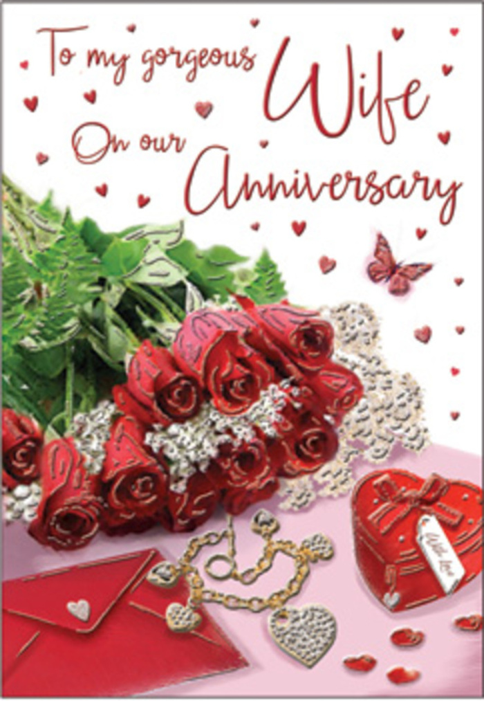 The image portrays an emotive anniversary arrangement with the visual richness of a lovingly prepared gift set on a polished surface in Beckton. At the centre, a hand-tied bouquet of classic red roses takes pride of place, each blossom open and opulent, their petals lush and velvety with subtle darker undertones near the centre. The roses are intertwined with fresh green foliage that frames the blooms, adding vibrancy and depth, much like an artful display you might see in a local Beckton flower shop. Surrounding the bouquet, fine details tell a story of long-standing affection: a jewellery set laid out carefully, its metallic surfaces catching the light in small, bright flashes; a vivid red box that suggests a treasured present about to be opened; and delicate lace-like textures and heart motifs that dance across the card's background. The atmosphere is undeniably romantic, supported by fabrics that appear to blend velvet, silk, and soft paper, creating a tactile sense of comfort and luxury. A neatly placed envelope anchors the composition, hinting at a written message of love to accompany the card and flowers, perhaps delivered to a quiet street near Newham Way or around the residential pockets of Beckton. Tiny hearts and shimmering embellishments are scattered like gentle reminders of shared memories, while the scripted anniversary message curves gracefully across the card, giving the eye a path to follow. The overall mood is one of intimate celebration-a warm embrace in visual form-perfect for marking an important milestone in a relationship, and reflecting the thoughtful, detail-oriented approach that Florist Beckton brings to special occasion arrangements and local deliveries.